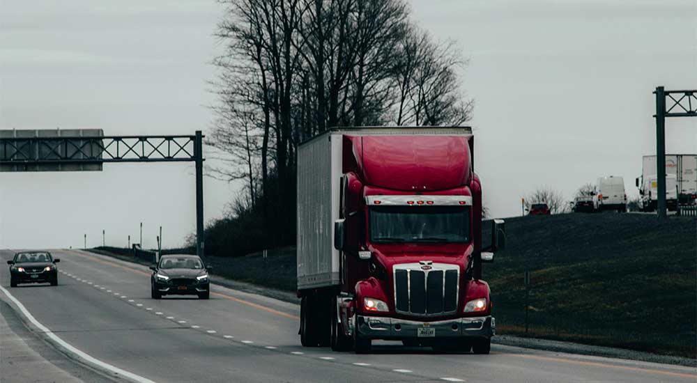 A highway focused on a semi-truck
